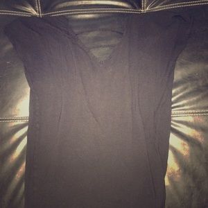 Black T-shirt with open back.